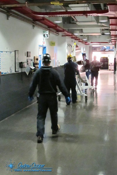 The team moving a mirror segment from the telescope to the coating facility