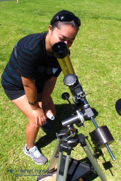 A visitor enjoys a great view of the Sun through a Coronado PST H&alpha; telescope