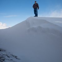 Eric gives scale to a rather large snowdrift in front of Keck Observatory