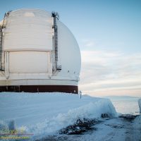 Deep drifts in front of Keck Observatory cut through by the MKSS snowplow crews