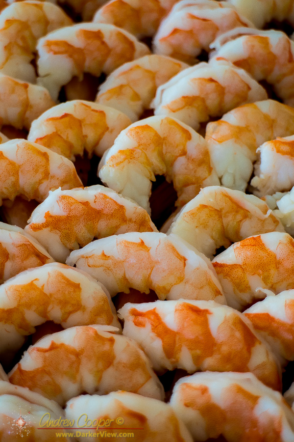 A tray of peeled shrimp await eating