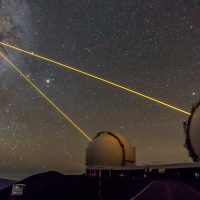 A pair of AO lasers used to observe the central region of the Milky Way Galaxy emerge from Keck 1 and Keck 2