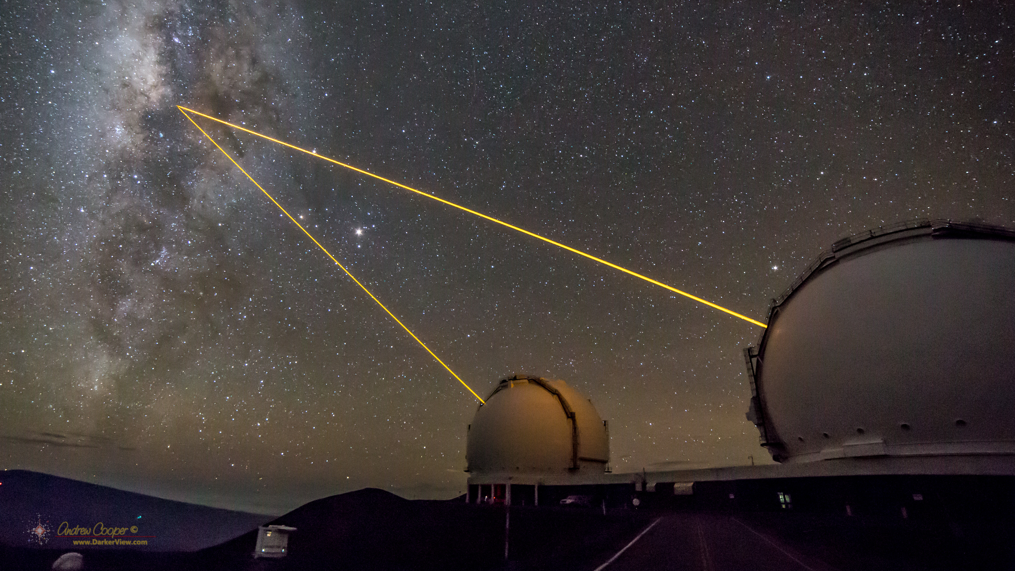 A pair of AO lasers used to observe the central region of the Milky Way Galaxy emerge from Keck 1 and Keck 2