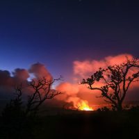 The glow from a lava lake in Halemaʻumaʻu lights the clouds prior to the May 2018 eruptions