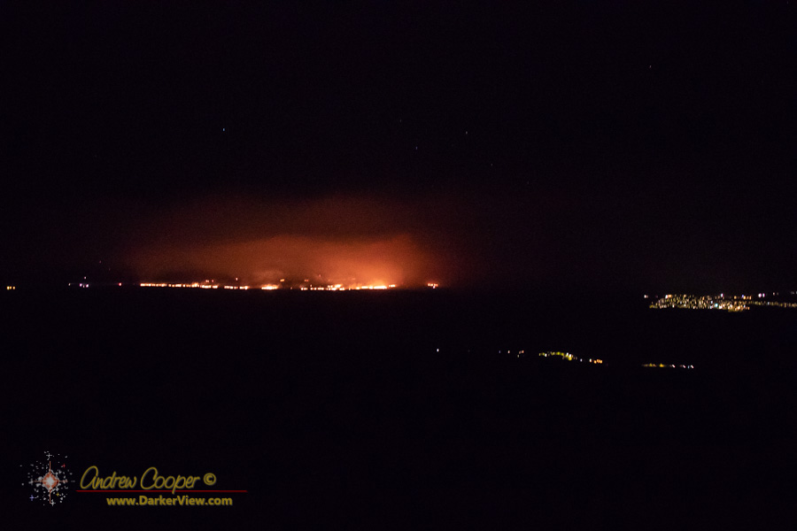A large wildfire burning above Waikoloa Village