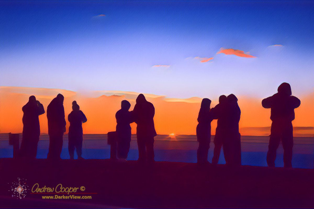 A crowd of tourists watching sunrise atop Mauna Kea