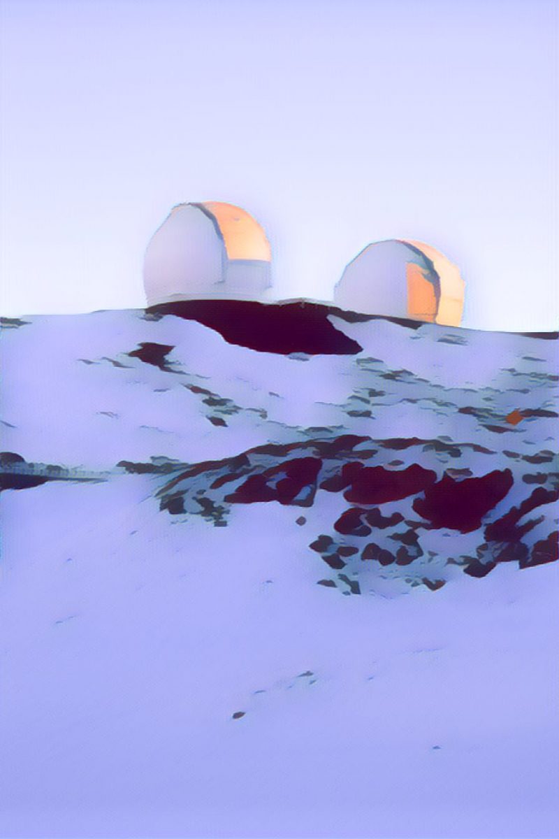 Looking up at the Keck Observatory domes in the first sunlight of dawn