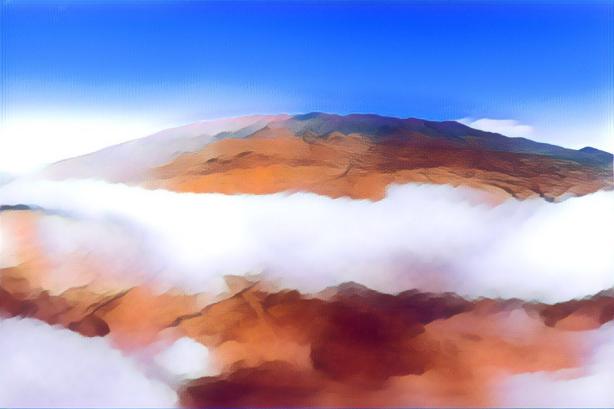 Mauna Kea looms above a low layer of clouds