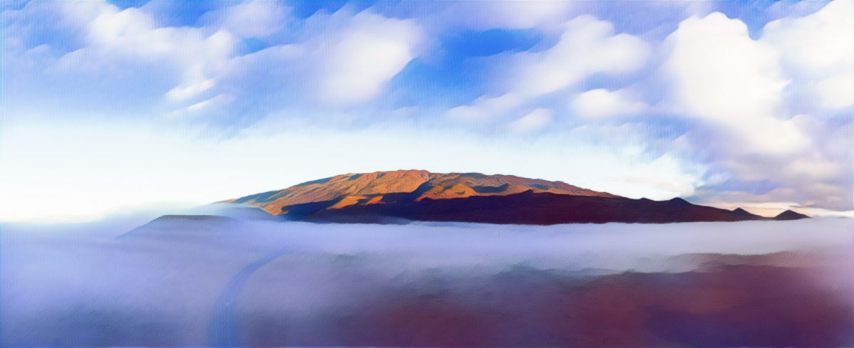 Mauna Kea sits above a fog shrouded Saddle Road