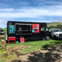 The Red Barn food truck serving up grilled sandwiches at the mid-week farmers market in Waimea