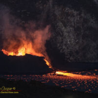 The western vent spilling lava into the lake at Halemaʻumaʻu