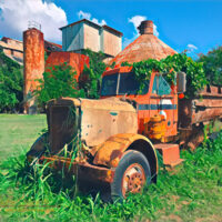 An abandoned truck sits outside the Kōloa sugar mill