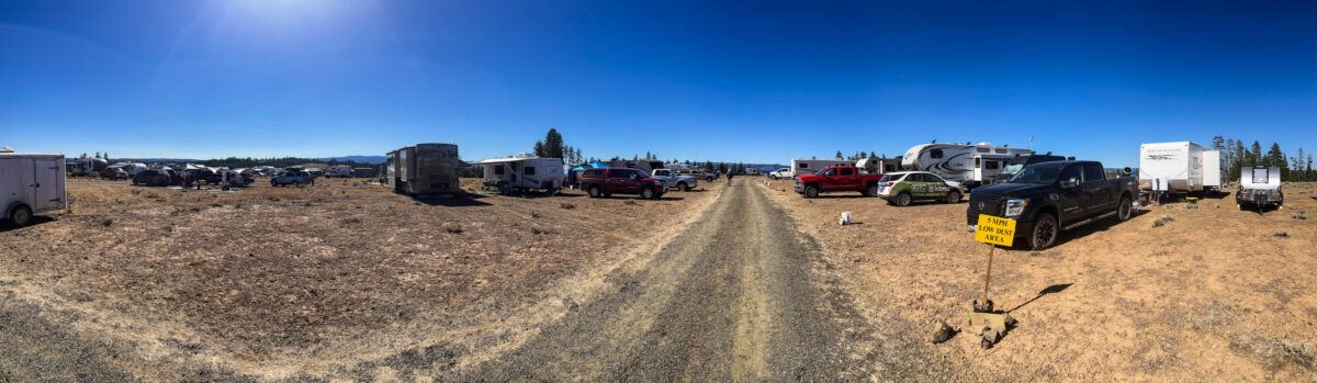 A large meadow filled with tents. RV's, and telescopes at Oregon Star Party 2023