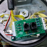 The newly replaced circuit boards and connectors in a Celestron NexStar 8SE