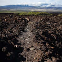 A historic trail winding across an aʻa lava flow