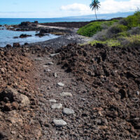 A historic trail leads along the shoreline to a beach at Akahu Kaimu