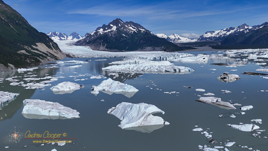 Icebergs scattered across the lake in front of Sheridan Glacier
