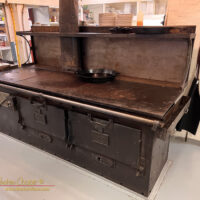A century old stove still serving in the dining hall of Orca Adventure Lodge, Cordova