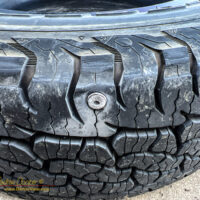 A machine screw in the tire