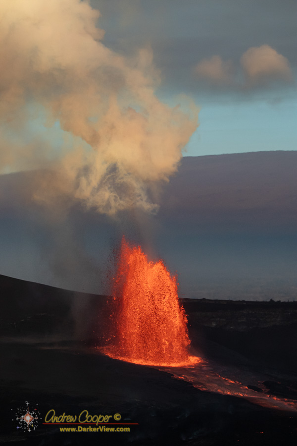 The tall lava fountian of episode 45 in Kilauea Caldera as photographed from the Keanakakoʻi Overlook with Mauna Loa in the background, on the morning of April 23 , 2026