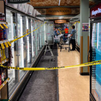 Employees of the Waikoloa Village KTA Market discard all the the ice cream after hurricane Lala