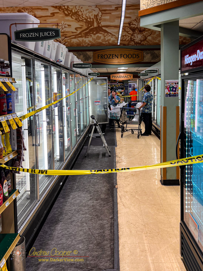 Employees of the Waikoloa Village KTA Market discard all the the ice cream after hurricane Lala