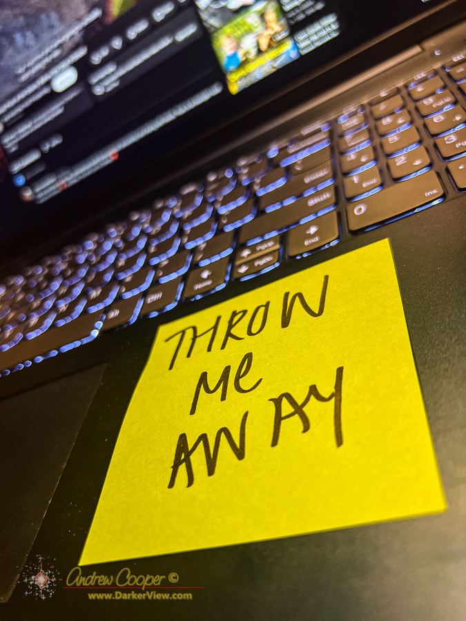 Throw me Away... A bright yellow sticky on a laptop computer