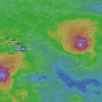 Hurricanes Lowell and Karina churn the ocean either side of the islands