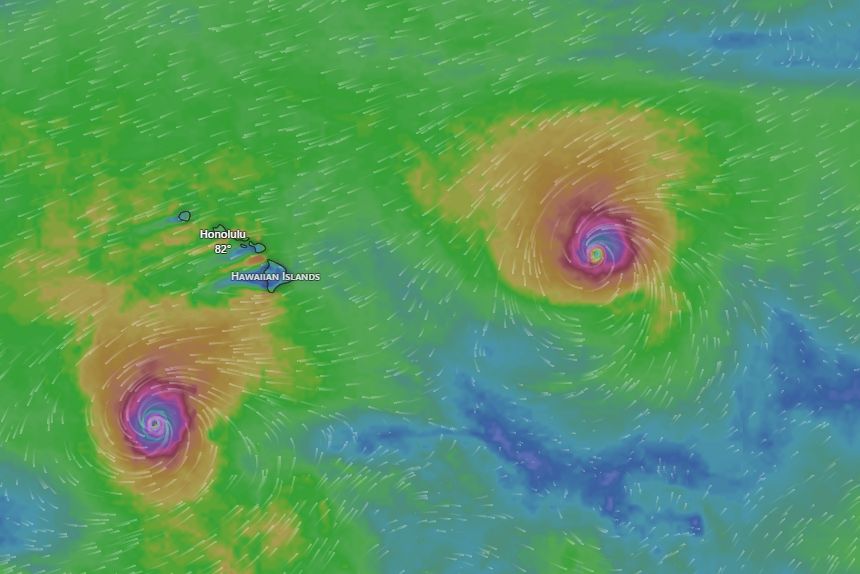 Hurricanes Lowell and Karina churn the ocean either side of the islands